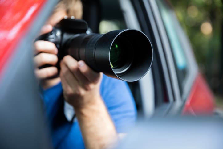 Man Photographing With SLR Camera judge banging brown gavel on desk